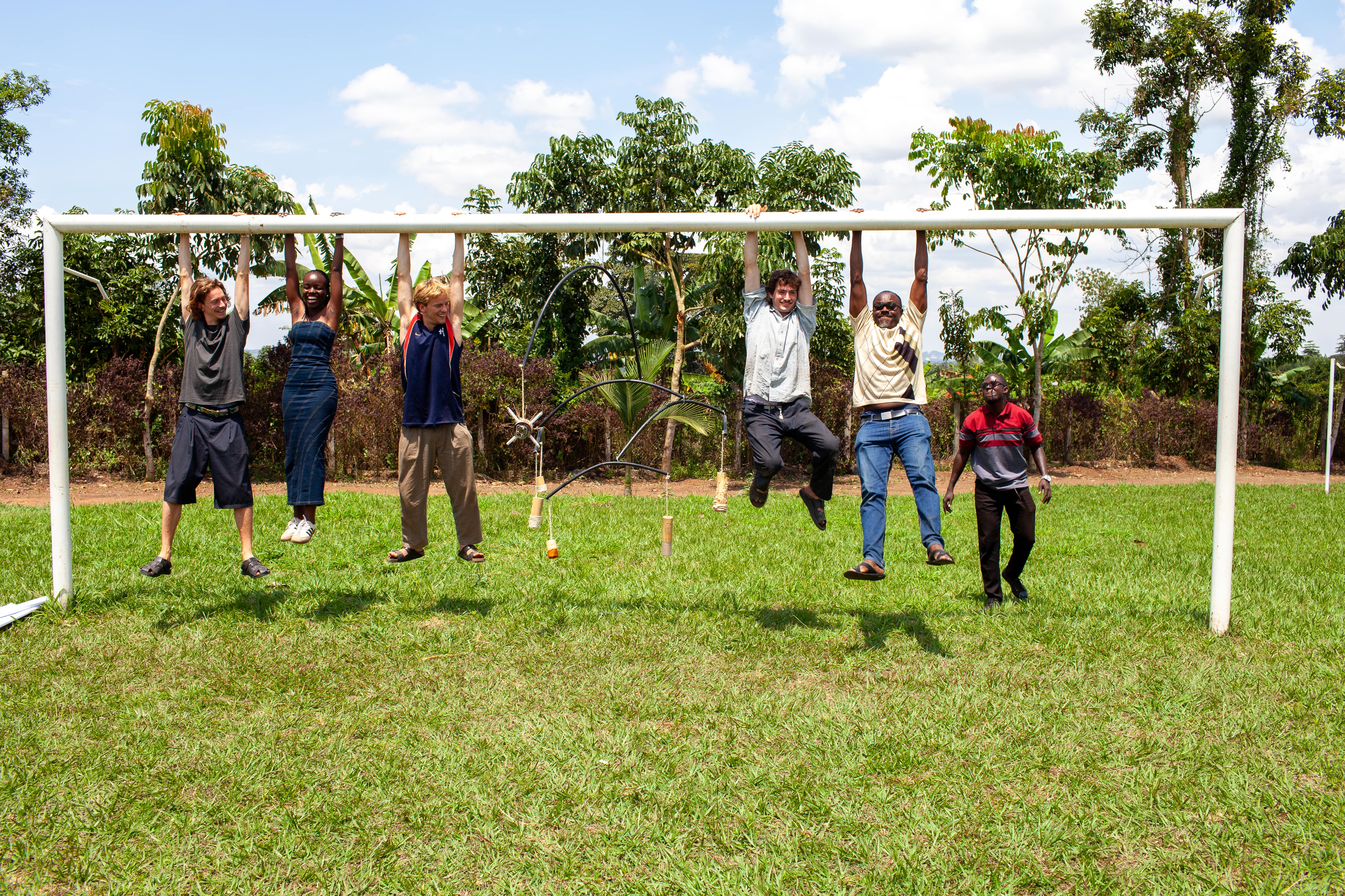 A playful moment captured as the international students and local team members take a break from their hard work.
