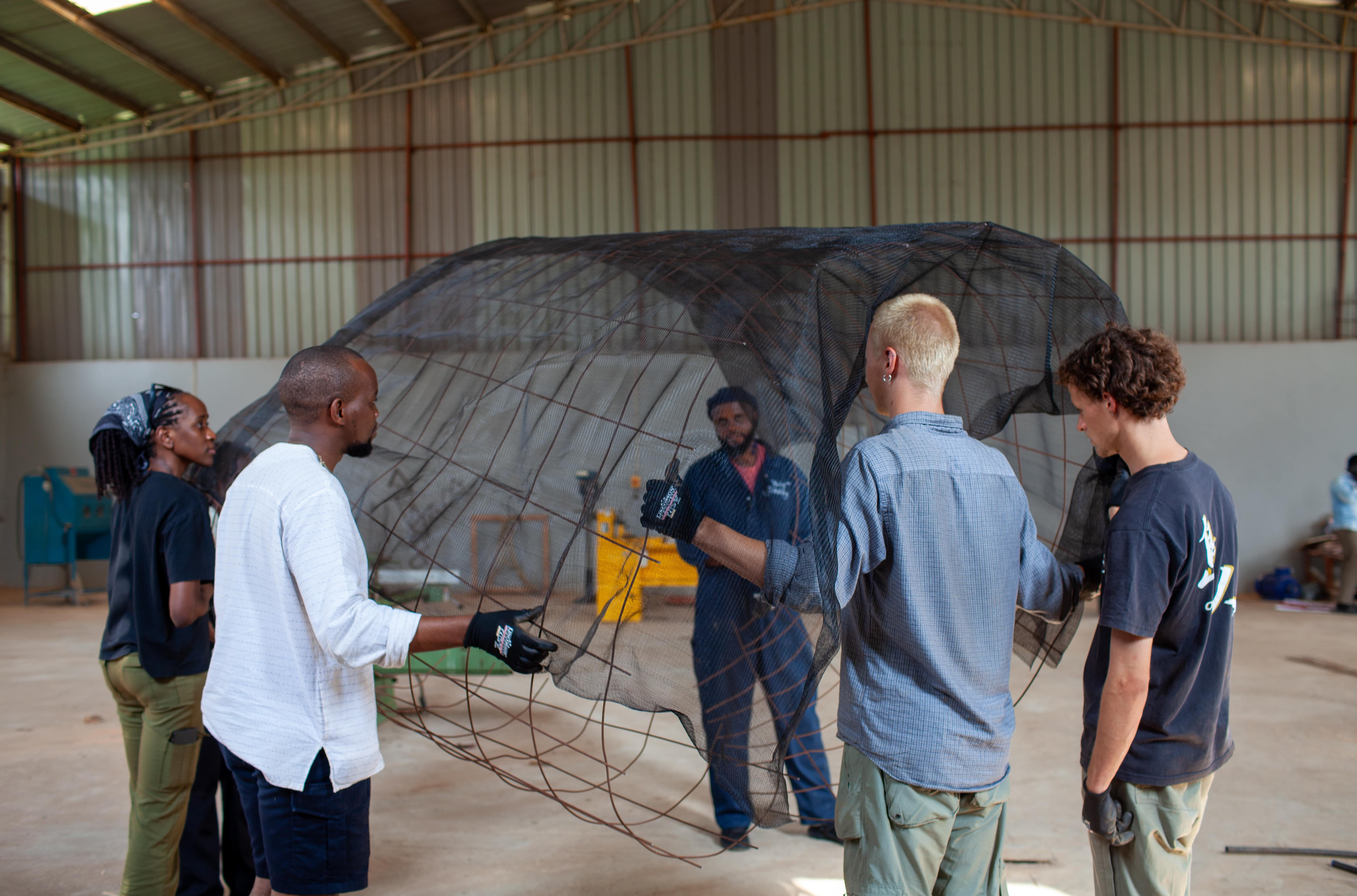 In the workshop, the structural frame of the installation begins to take shape through a collaborative team effort.