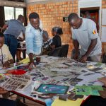A hive of activity as the team works together, cutting and pasting to visualize their installation ideas
