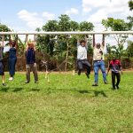 A playful moment captured as the international students and local team members take a break from their hard work