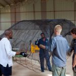 In the workshop, the structural frame of the installation begins to take shape through a collaborative team effort